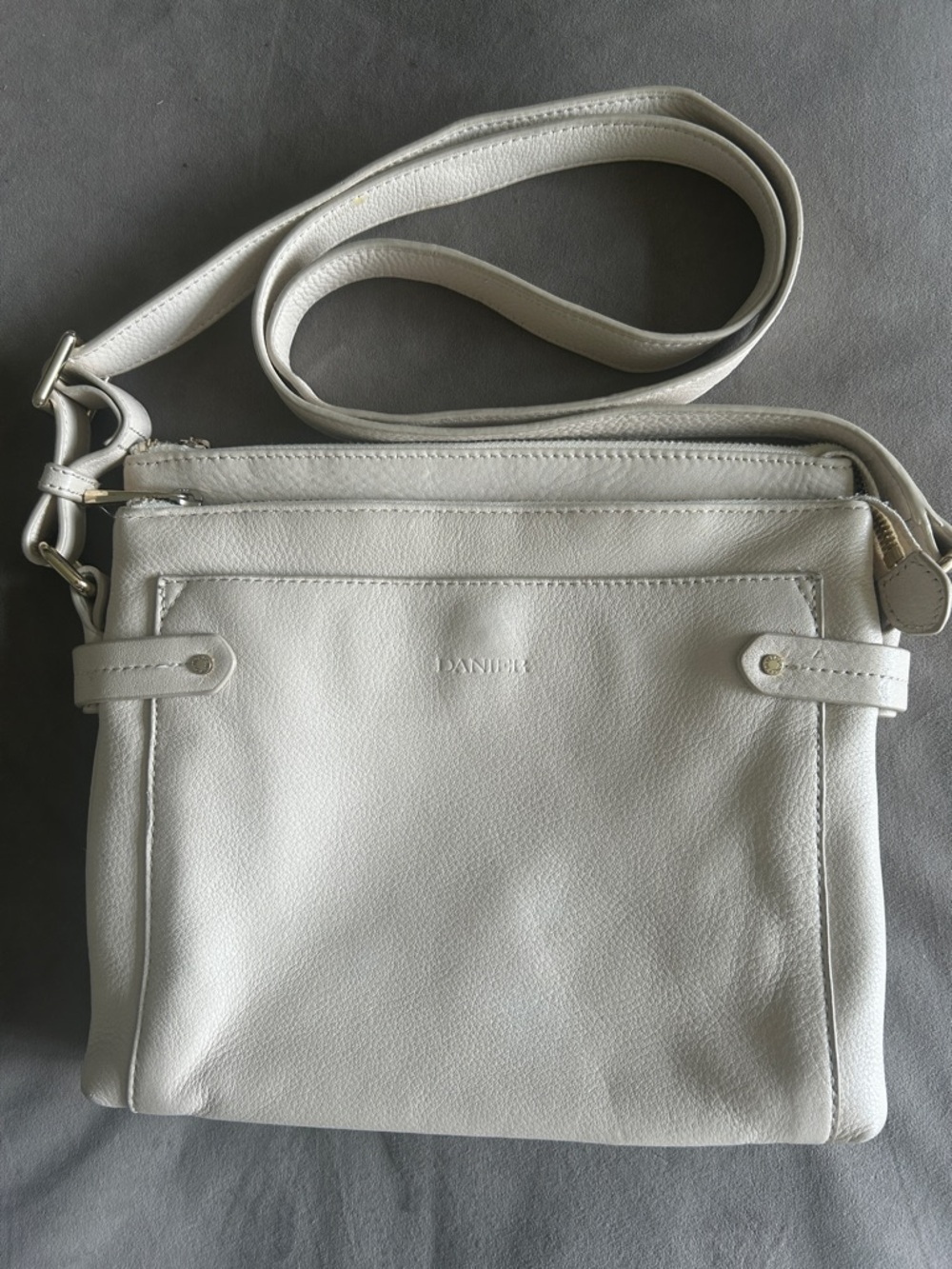 Danier Cream Leather Cross Body Bag. 10” by 9” by 2”
